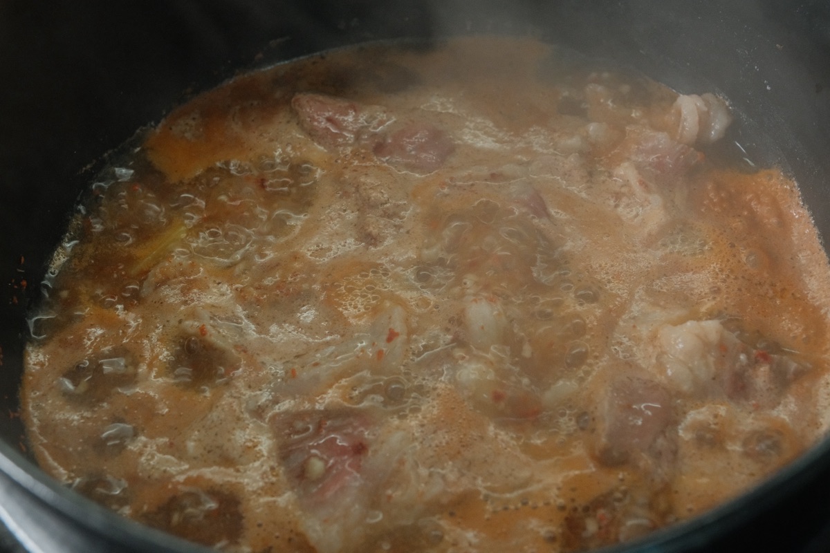 Gamjatang simmering in a pot with beef and potatoes
