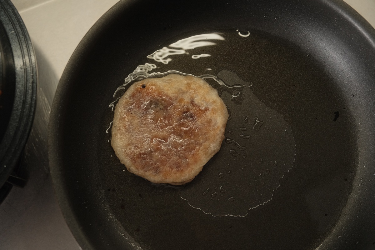Paratha hotteok frying until crisp and golden on the second side