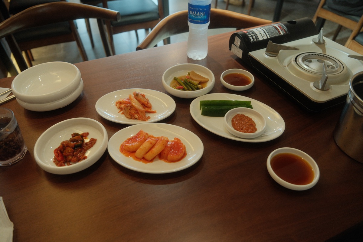 Korean side dishes served with gamjatang at GAMJA Singapore