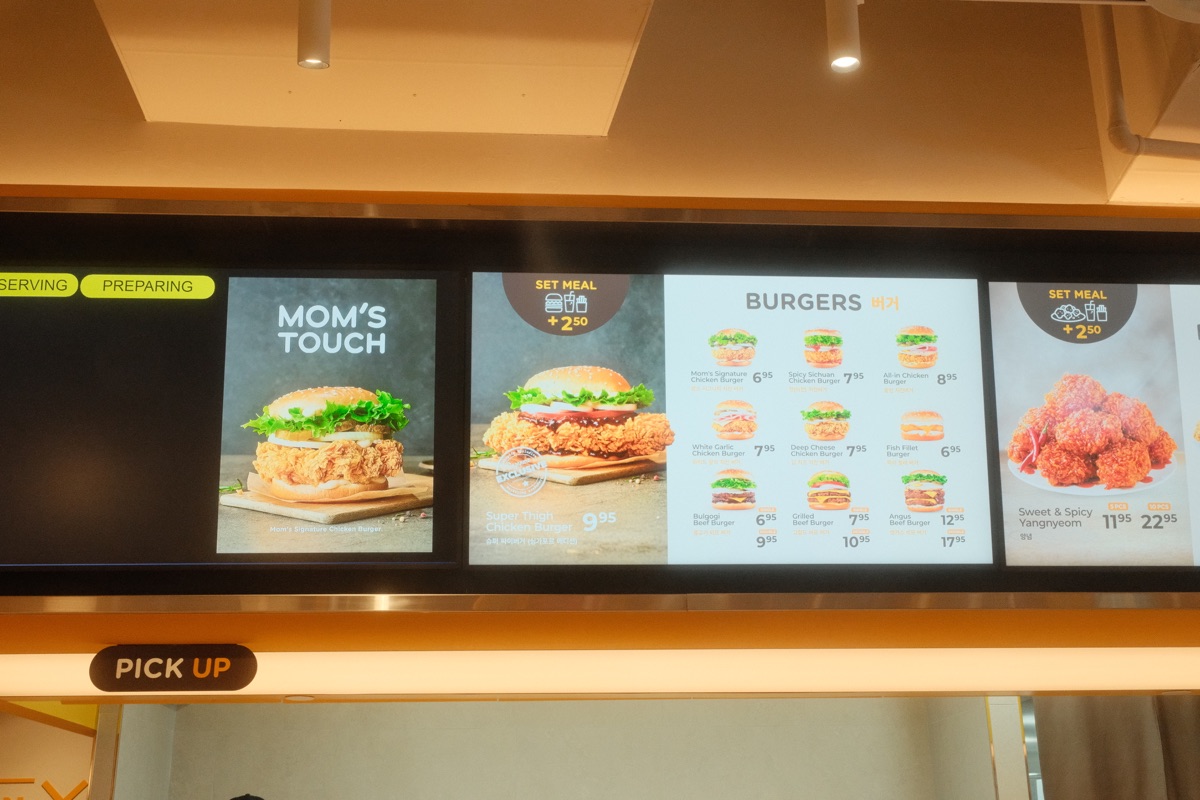Mom's Touch Singapore menu boards showing burgers and fried chicken