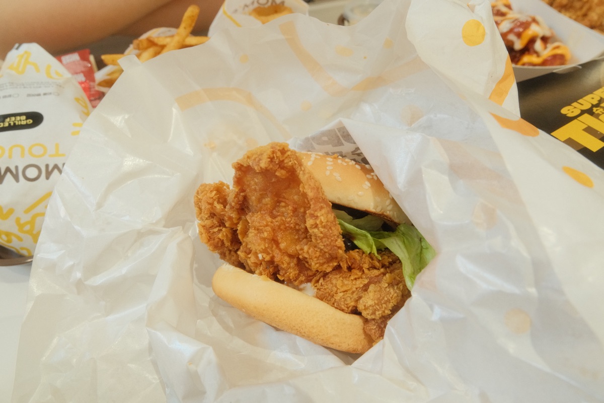 Super Thigh Chicken Burger with a whole crispy chicken thigh inside the bun