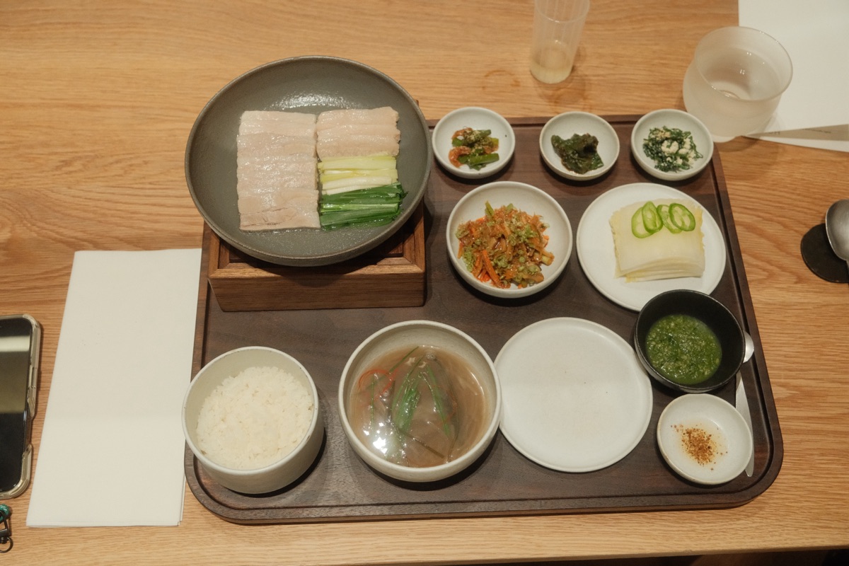 Jeju Black Pork Bossam full tray spread with banchan