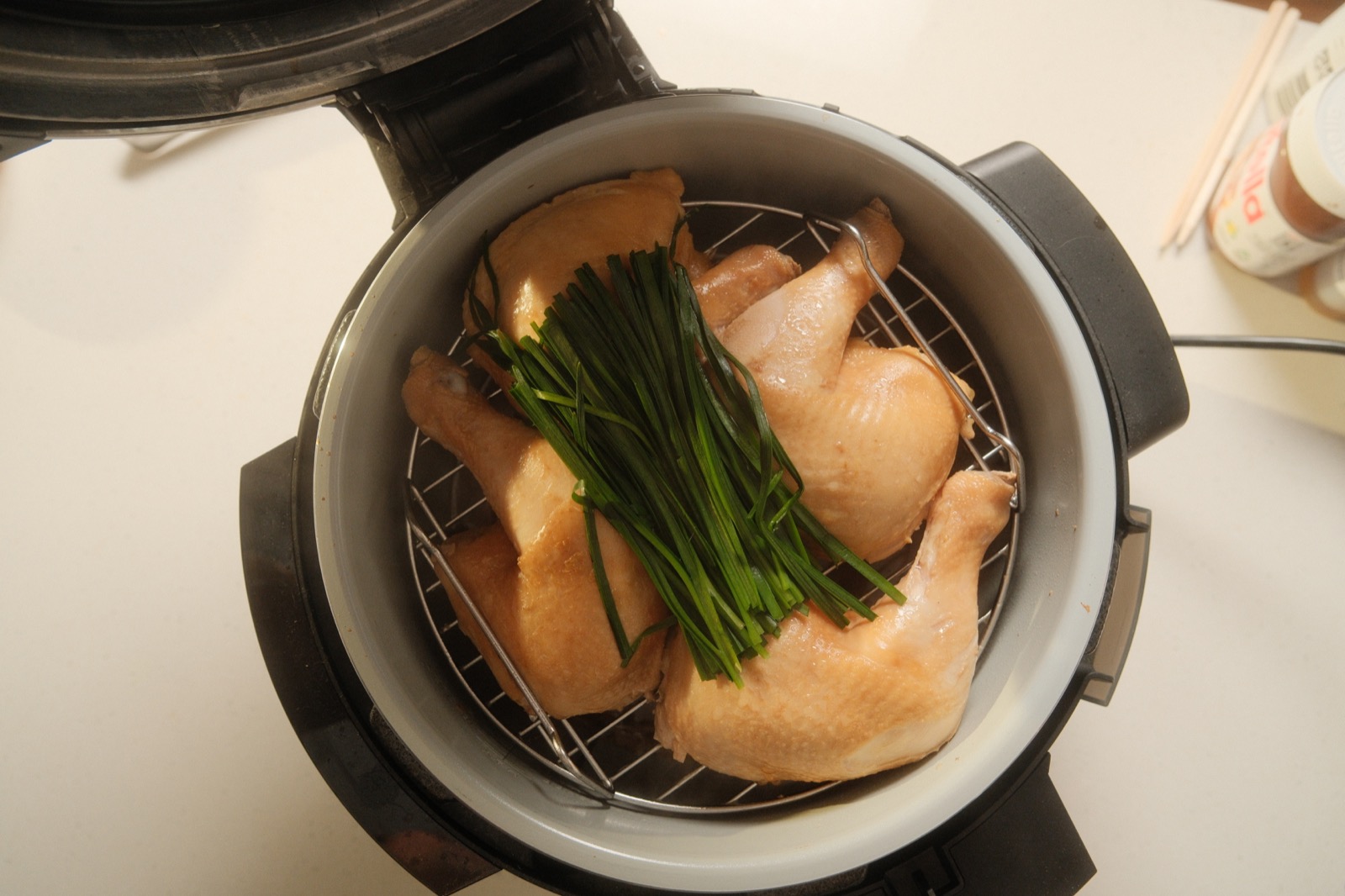 Broth base with vegetables simmering in the pot
